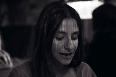 Close-up portrait of a smiling young woman