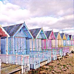 Beach huts against sky