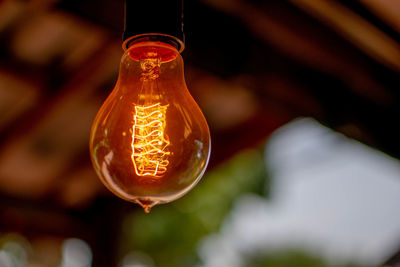 Close-up of illuminated light bulb