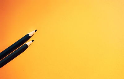 High angle view of pen against orange sky