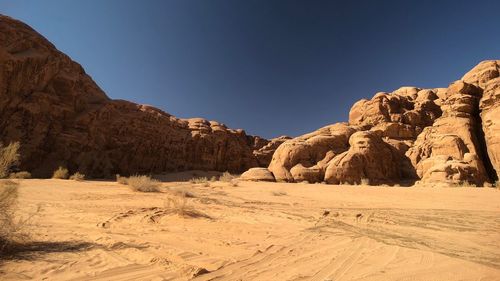 Rock formations in desert against clear sky