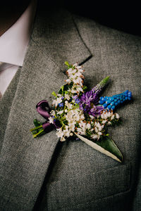 Close-up of flowers on wedding blazer