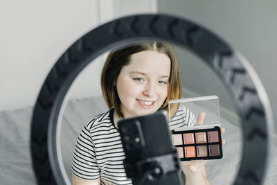 Make up influencer vlogging at home