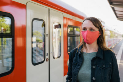 Portrait of woman at railroad station