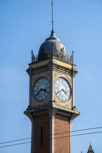 Low angle view of clock tower against sky