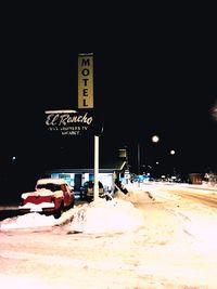 View of snow on field against sky at night