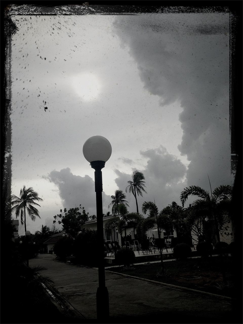 transfer print, sky, street light, auto post production filter, cloud - sky, tree, lighting equipment, silhouette, cloud, dusk, built structure, cloudy, tranquility, nature, outdoors, street, road, building exterior, no people, sunset