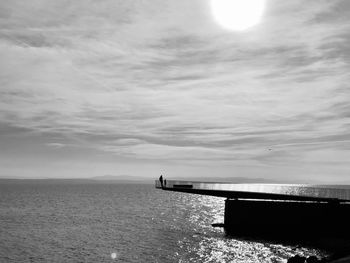 Pier over sea against sky