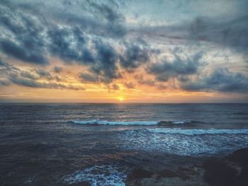 Scenic view of sea against sky during sunset