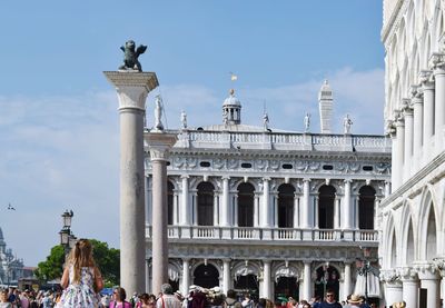 People in front of historical building