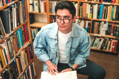 Portrait of man reading book