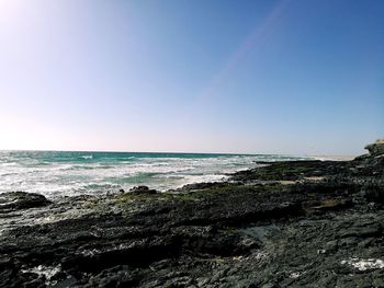 Scenic view of sea against clear sky