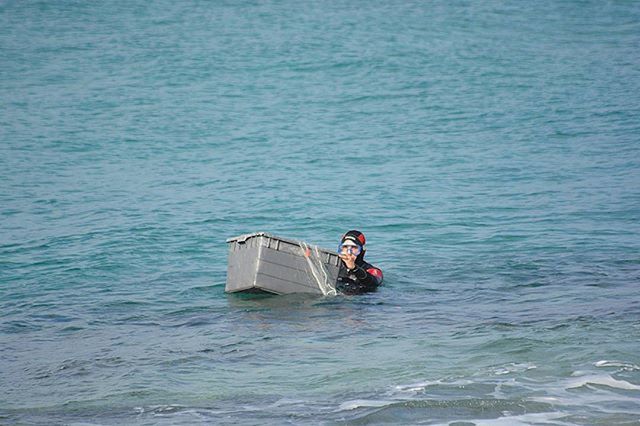 water, nautical vessel, sea, transportation, lifestyles, leisure activity, waterfront, boat, mode of transport, men, rippled, sitting, vacations, travel, nature, oar, sailing, day