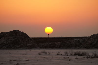 Scenic view of landscape against sky during sunset