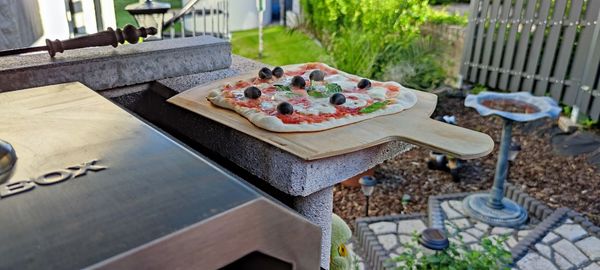 High angle view of pizza on table in yard