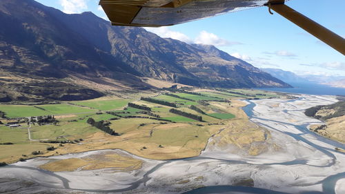 Aerial view of landscape and mountains against sky