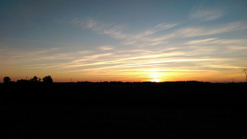 Scenic view of silhouette landscape against sky during sunset