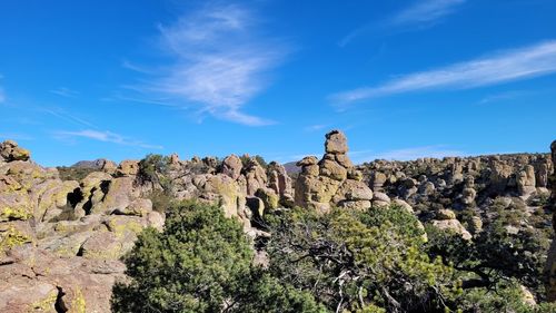 Panoramic view of rock formations against sky