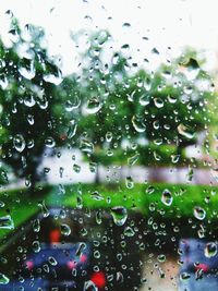 Raindrops on glass window during rainy season