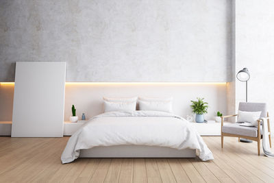 White table and chairs on bed against wall at home