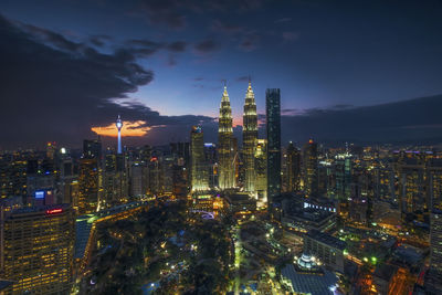 Aerial view of city lit up at night