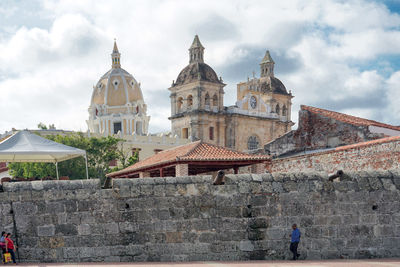 Historic building against cloudy sky