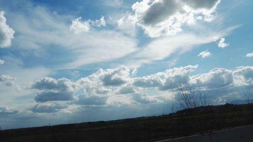 Scenic view of landscape against cloudy sky