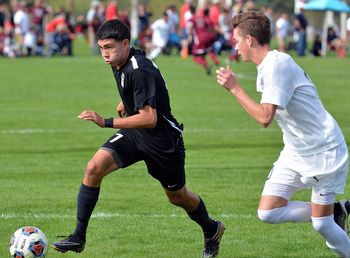 Man playing soccer on field