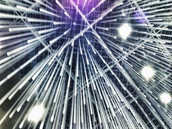 Low angle view of illuminated lights at night