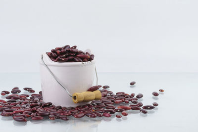 Close-up of fruits on table against white background