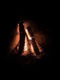 Shadow of people on log at night