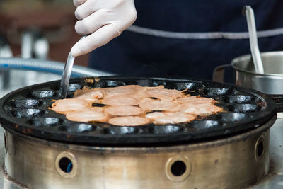 Close-up of man preparing food