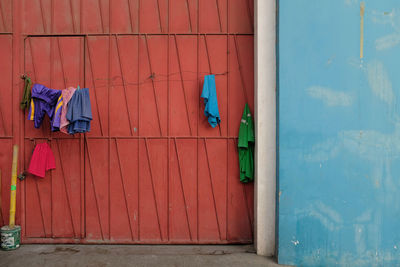 Clothes drying against closed door of building