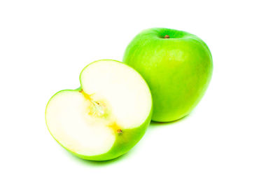 Close-up of green apple against white background