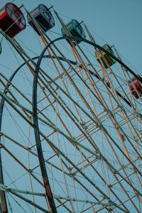 Low angle view of ferris wheel against sky