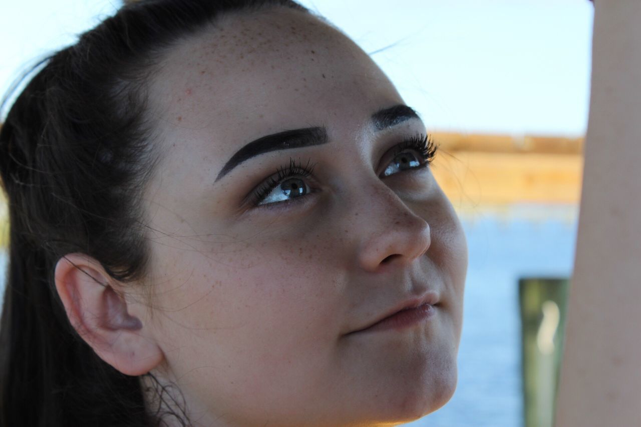 one person, close-up, real people, young adult, human face, focus on foreground, young women, headshot, childhood, outdoors, day, portrait