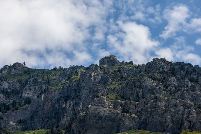 Low angle view of rock formation against sky