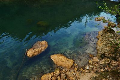 High angle view of rocks in lake