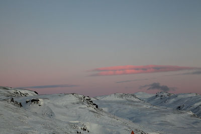 Scenic view of snowcapped mountain against sky during sunset