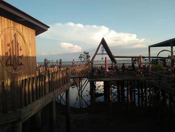 Pier over lake against sky