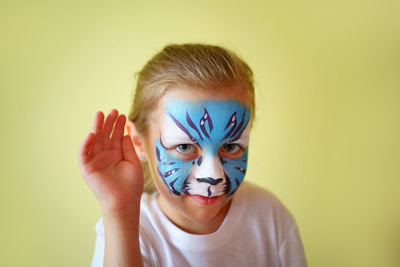 Girl aqua makeup in the form of a blue water tiger zodiac on a white background, new year 2022