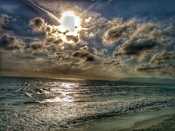 Scenic view of sea against cloudy sky