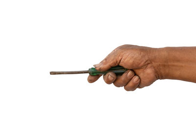 Close-up of hand holding hands against white background