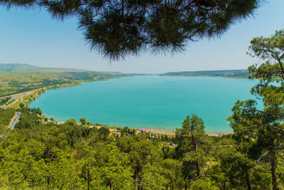 High angle view of bay against clear sky