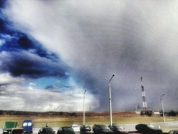 View of road against cloudy sky