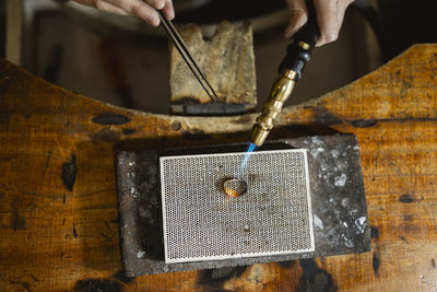 Cropped hand of man working on table