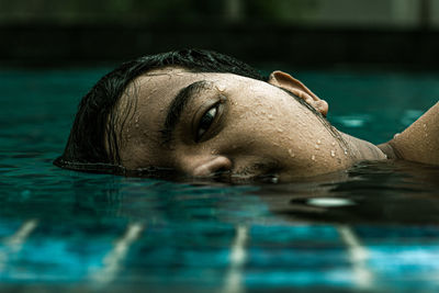 Close-up of man face in swimming pool