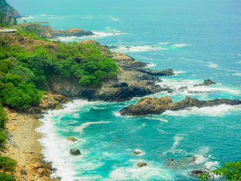 High angle view of sea shore against sky