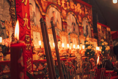 Illuminated candles in temple