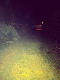 Close-up of illuminated lighting equipment at night